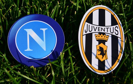 September 6, 2019, Turin, Italy. Emblems of Italian football clubs Juventus Turin and Napoli Naples on the green grass of the lawn.