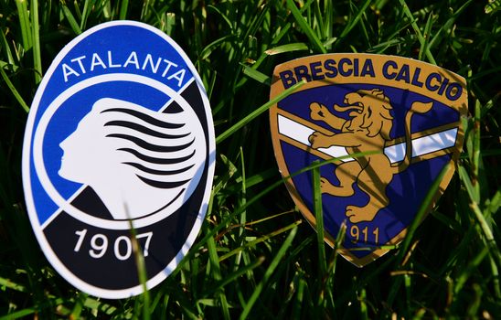 September 6, 2019, Turin, Italy. Emblems of Italian football clubs Brescia and Atalanta Bergamo on the green grass of the lawn.