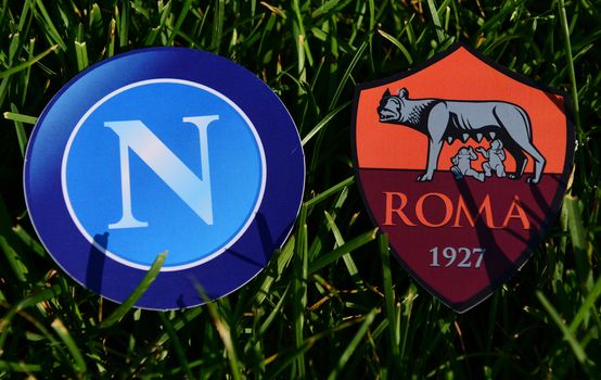 September 6, 2019, Turin, Italy. Emblems of Italian football clubs Roma and Napoli Naples on the green grass of the lawn.