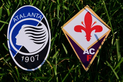 September 6, 2019, Turin, Italy. Emblems of Italian football clubs Atalanta Bergamo and Fiorentina Florence on the green grass of the lawn.