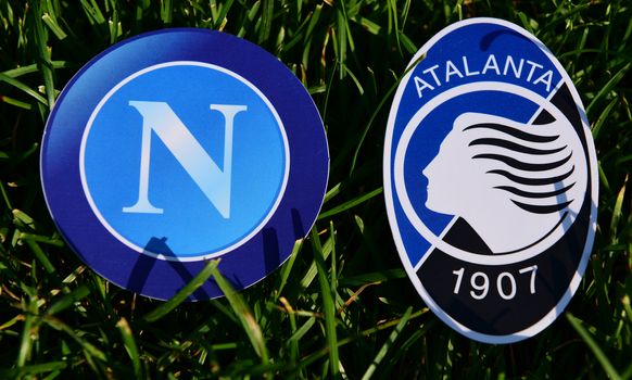 September 6, 2019, Turin, Italy. Emblems of Italian football clubs Atalanta Bergamo and Napoli Naples on the green grass of the lawn.