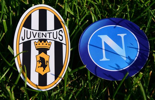 September 6, 2019, Turin, Italy. Emblems of Italian football clubs Juventus Turin and Napoli Naples on the green grass of the lawn.