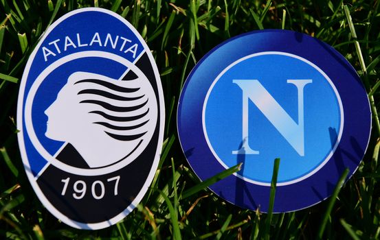 September 6, 2019, Turin, Italy. Emblems of Italian football clubs Atalanta Bergamo and Napoli Naples on the green grass of the lawn.