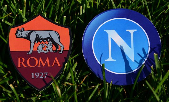 September 6, 2019, Turin, Italy. Emblems of Italian football clubs Roma and Napoli Naples on the green grass of the lawn.