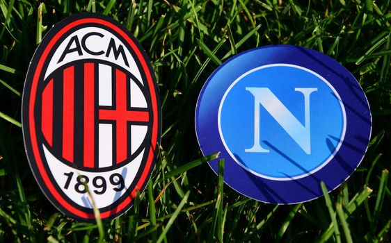 September 6, 2019, Turin, Italy. Emblems of Italian football clubs Milan and Napoli Naples on the green grass of the lawn.