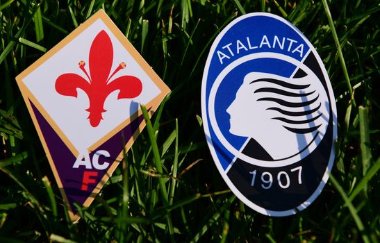 September 6, 2019, Turin, Italy. Emblems of Italian football clubs Atalanta Bergamo and Fiorentina Florence on the green grass of the lawn.