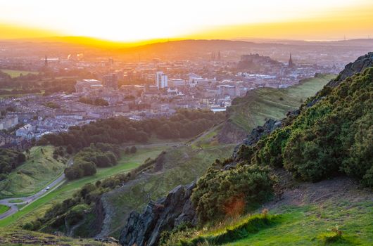 Edinburgh Cityscape As Seen From Arthurs Seat During A Beautiful Summer Sunset