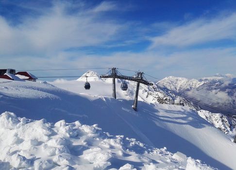Winter ski resort, mountain views, ski lift and slopes