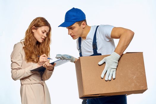 worker man next to woman customer delivery work service. High quality photo