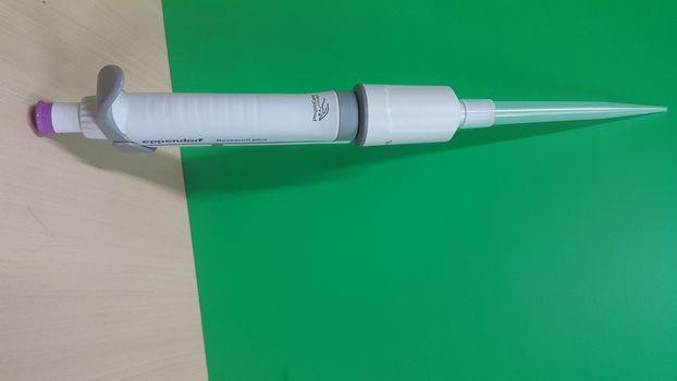 Micro pipettes, micro-chemical equipment placed on a green sheet