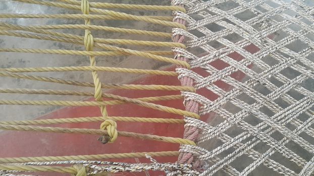 Closeup view of dried jute thread or ropes interwoven for making traditional old style bed called charpai