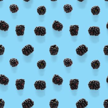 Bramble Seamless pattern. Fresh blackberry seamless pattern. Square pattern with fresh wild berries isolated on blue background. flat lay.