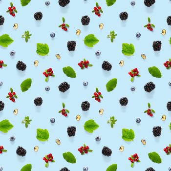 Creative seamless pattern of wild berries, blackberry, blueberry, lingonberry and bramble. modern seamless pattern on blue backgriund made from autumn forest wild berries. Forest berries mix