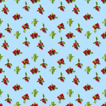 Lingonberry seamless pattern on blue background. Fresh cowberries or cranberries with leaves as seamless pattern for textile, fabric, print or posters