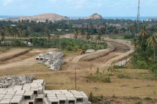 Construction of a complex on the Motogp Mandalika circuit, West Nusa Tenggara, Lombok, Indonesia. Building a racetrack for motorcycles.