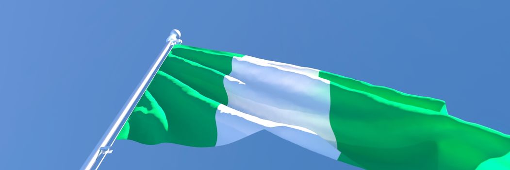 3D rendering of the national flag of Nigeria waving in the wind against a blue sky