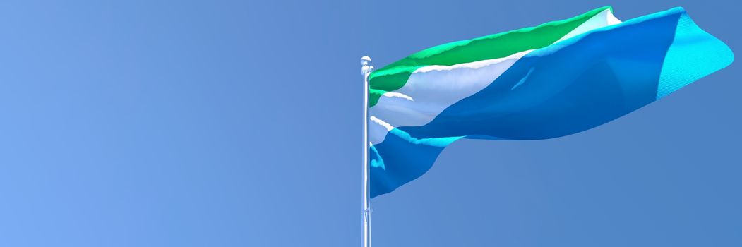 3D rendering of the national flag of Sierra Leone waving in the wind against a blue sky