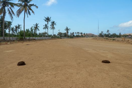 Start position between two cow shit on sand rice circuit. Moto GP Mandalika racing circuit under construction, West Nusa Tenggara, Lombok, IndonesiaRailway under construction.