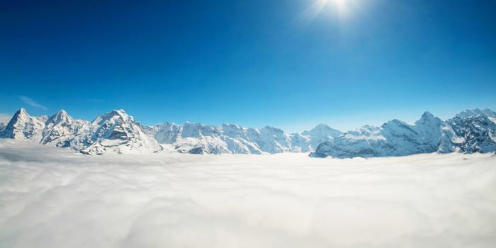 Stunning Panoramic view Snow moutain of the Swiss Skyline from Piz Gloria Schilthorn, Switzerland