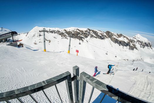 Skier skiing downhill in high mountains in Piz Gloria at Switzerland