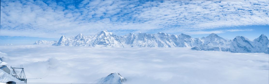 Stunning Panoramic view Snow moutain of the Swiss Skyline from Piz Gloria Schilthorn, Switzerland