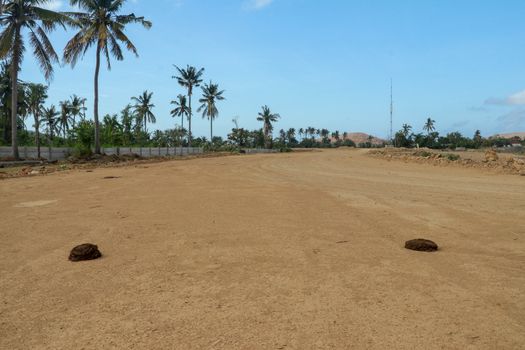 Start position between two cow shit on sand rice circuit. Moto GP Mandalika racing circuit under construction, West Nusa Tenggara, Lombok, IndonesiaRailway under construction.