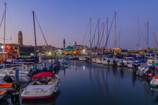 Evening view of the fishing port and other monuments, in the old city of Acre (Akko), Israel