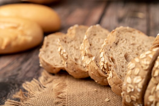 breads sliced on the sack with a wooden table