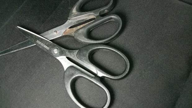 silver and black colored scissors closeup