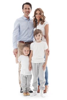 Portrait of happy family of parents and two children studio isolated on white background