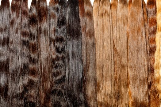 Natural chocolate colored shiny healthy human hair bundles for extension and weave wigs making.