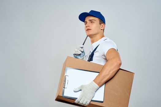 Man worker with box in hands delivery loading service packing service. High quality photo