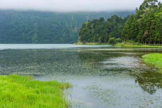 View of the Lake of Sete Cidades in the fog, a volcanic crater lake on Sao Miguel island, Azores, Portugal