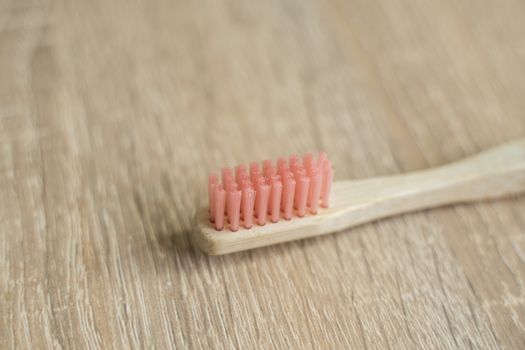 Eco-friendly bamboo toothbrush on a table. Zero-waste. Biodegradable toothbrush