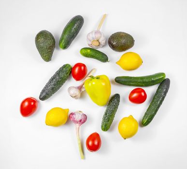 Shopping bag with assortment of fresh vegetables on white background