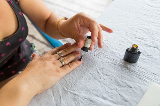 Staining nail gel polish. Self-manicure during self-isolation with coronovirus. The concept of personal care in all life circumstances