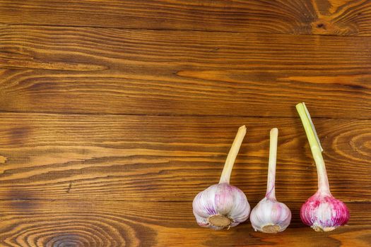 High Angle Still Life View of garlic on Rustic Wood Table.