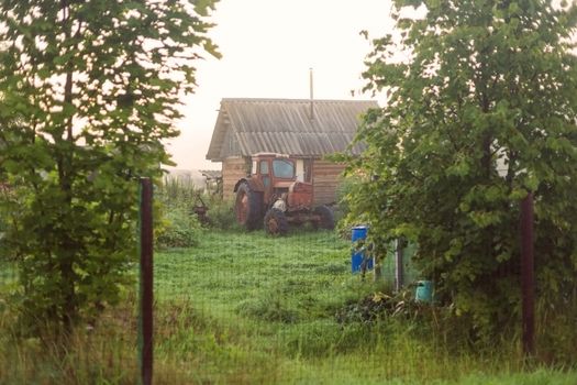 Rural landscape on a early foggy morning in the village