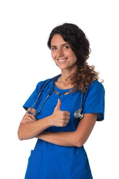 Portrait of happy smiling female nurse in blue uniform with stethoscope showing thumb up isolated on white background