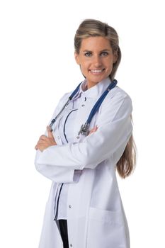 Portrait of female medical doctor with stethoscope standing with arms crossed and smiling isolated on white background