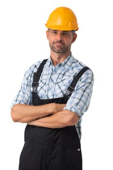Portrait of a workman in coveralls and hardhat standing with arms folded isolated on white background