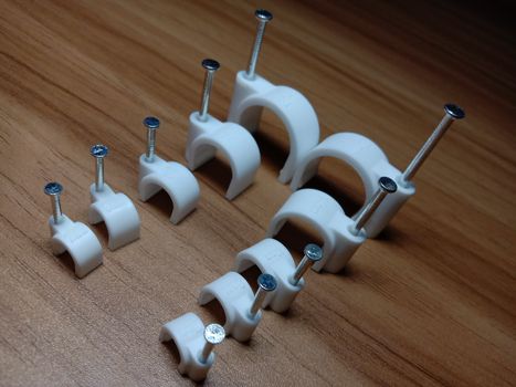 white colored wire pin on wooden table