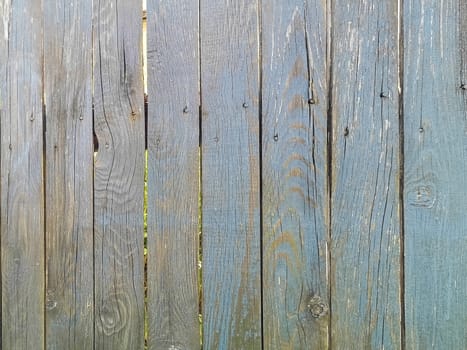 Green wood texture background. .Old ragged painted fence