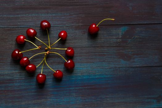 Fresh cherry on the table on wooden blue background. fresh ripe cherries. sweet cherries.