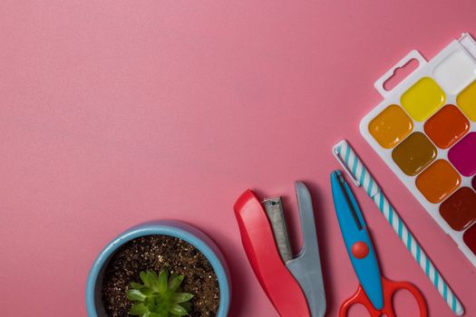 School supplies. Top view on a pink background with copy space. Back to school concept.