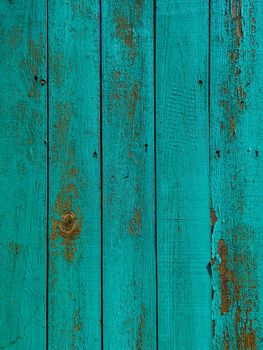 Green wood texture background. .Old ragged painted fence