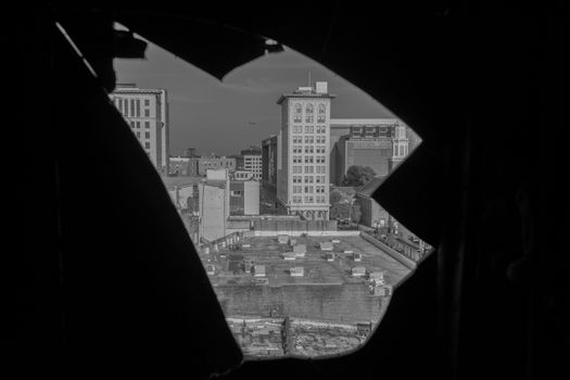 A City Skyline With a Plane Through a Sharp Hole in a Wall