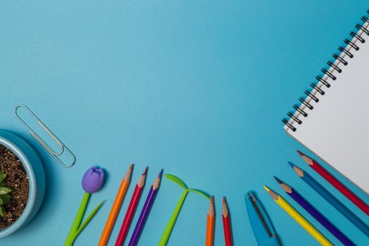 School supplies. Top view on a blue background with copy space. Back to school concept.