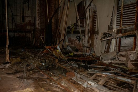 A Theatre Stage in an Abandoned Building Covered in Trash and Debris