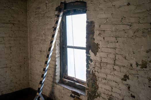 An Old Window Shining Light Into a Room in an Abandoned Building